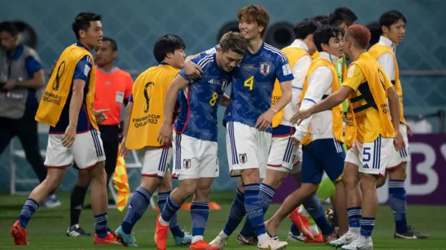 Japan celebrating a goal