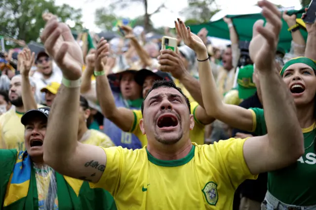 A man wearing a Brazil football cries during a protest held by supporters of President Jair Bolsonaro