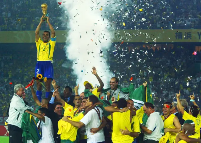 Cafu holds the World Cup in 2002