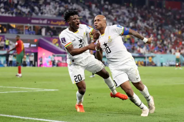 Andre Ayew of Ghana celebrates with Mohammed Kudus