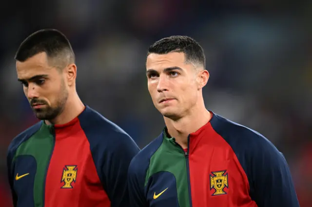 Cristiano Ronaldo (R) and Diogo Dalot (L) emotional during the national anthem