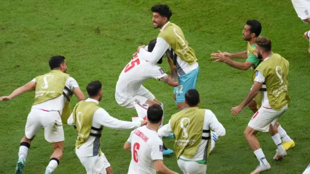 Iran players celebrate