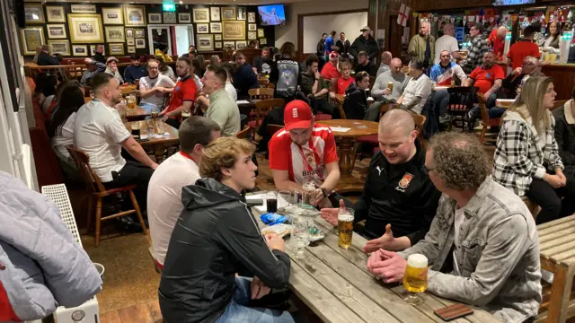 Fans packed into a pub