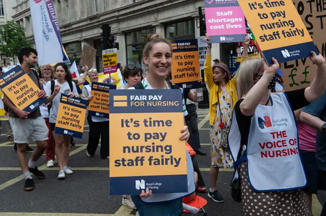 Nurses protesting with large cards