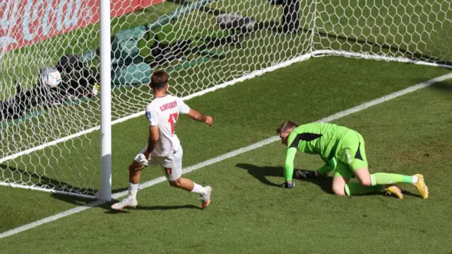 Sardar Azmoun puts the ball in the net