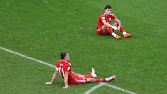 Gareth Bale and Joe Rodon look dejected