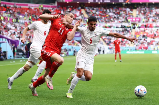 Gareth Bale battles for the ball