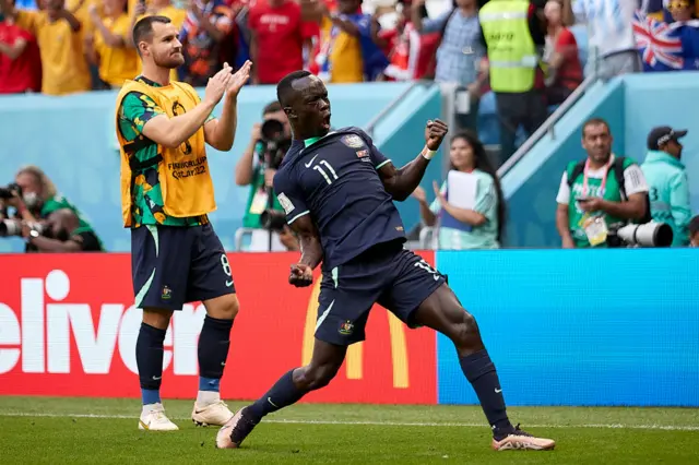 Awer Mabil of Australia celebrates the victory after the FIFA World Cup Qatar 2022 Group D match between Tunisia and Australia at Al Janoub Stadium on November 26, 2022 in Al Wakrah, Qatar