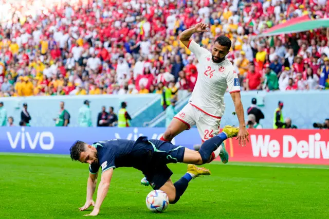 Mathew Leckie of Australia and Ali Abdi of Tunisia battle for the ball during the FIFA World Cup Qatar 2022 Group D match between Tunisia and Australia at Al Janoub Stadium on November 26, 2022 in Al Wakrah