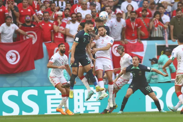 Mathew Leckie (7) of Australia in action against Montassar Talbi (3) of Tunisia during the FIFA World Cup Qatar 2022 Group D match between Tunisia and Australia at Al Janoub Stadium in Al Wakrah