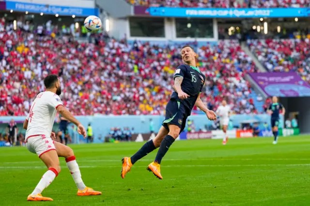 Australiua's Mitchell Duke scores header v Tunisia in 2022 FIFA World Cup match in Qatar.