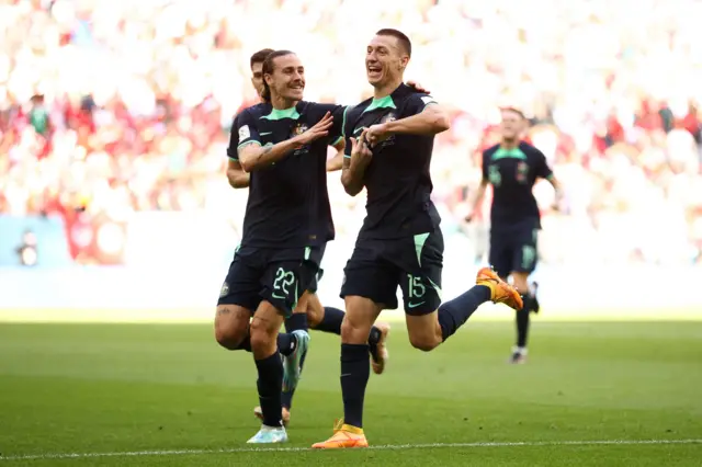 Mitchell Duke (R) of Australia celebrates after scoring their team's first goal with their teammates Jackson Irvine (C) during the FIFA World Cup Qatar 2022 Group D match between Tunisia and Australia at Al Janoub Stadium on November 26, 2022 in Al Wakrah