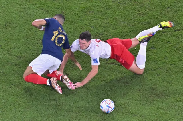 Kylian Mbappe is fouled by Andreas Christensen