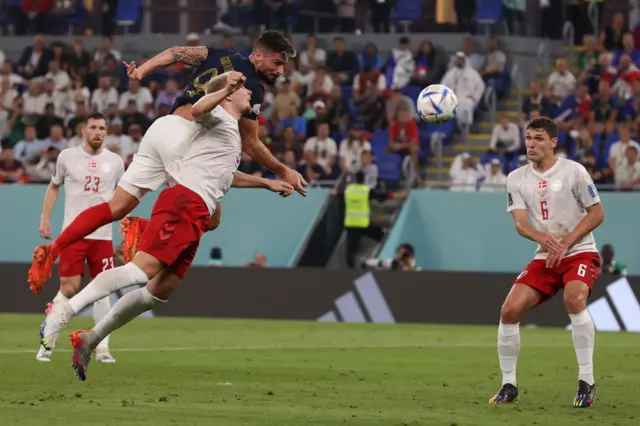 Olivier Giroud heads a Kylian Mbappe cross wide