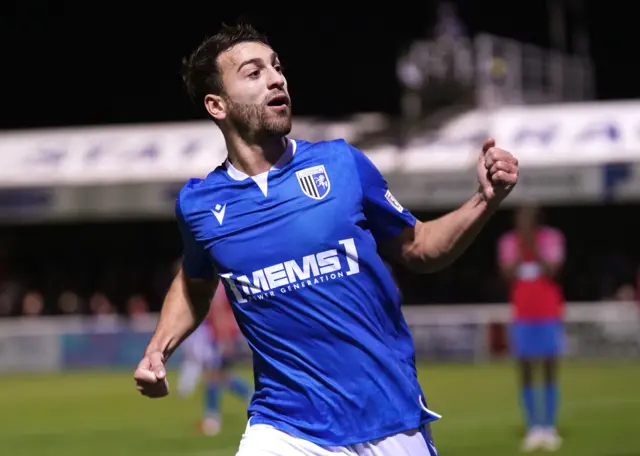 Scott Kashket celebrates his equaliser at Dagenham