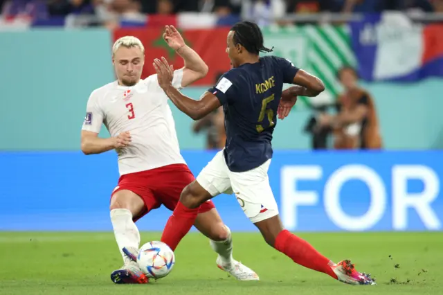 France defender Jules Kounde fouls Victor Nelsson