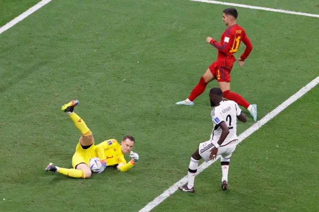 Goalkeeper Manuel Neuer of Germany intercepts a pass during the FIFA World Cup 2022 group E soccer match between Spain and Germany at Al Bayt Stadium in Al Khor, Qatar