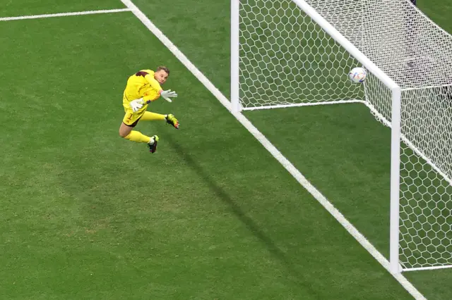 Manuel Neuer pushes a Dani Olmo strike onto the bar