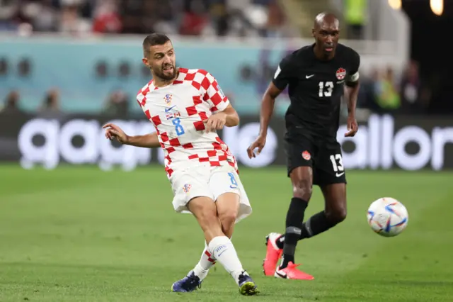 Mateo Kovacic of Croatia and Atiba Hutchinson of Canada during the FIFA World Cup Qatar 2022 Group F match between Croatia and Canada at Khalifa International Stadium on November 27, 2022 in Doha