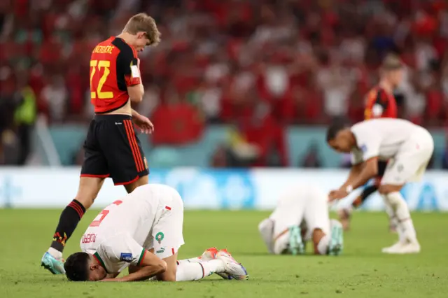 Morocco celebrate beating Belgium at the World Cup