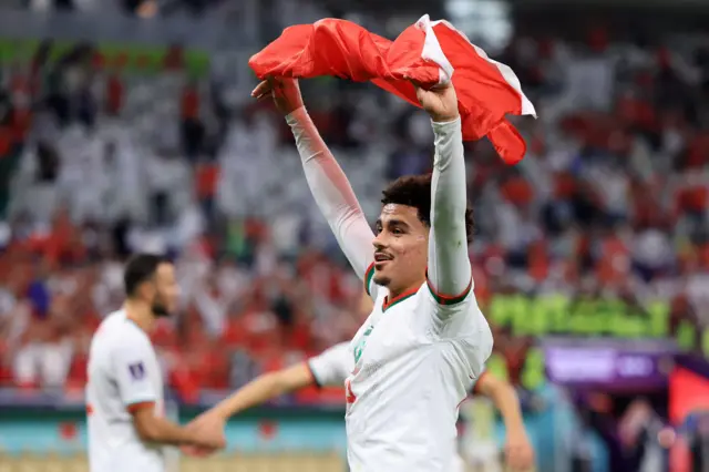 Morocco celebrate beating Belgium at the World Cup