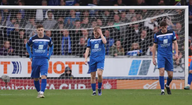 Chippenham players look dejected