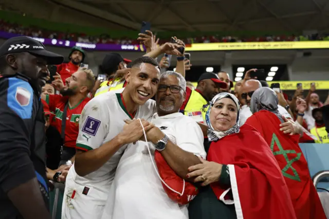 Morocco players celebrate with their friends and family