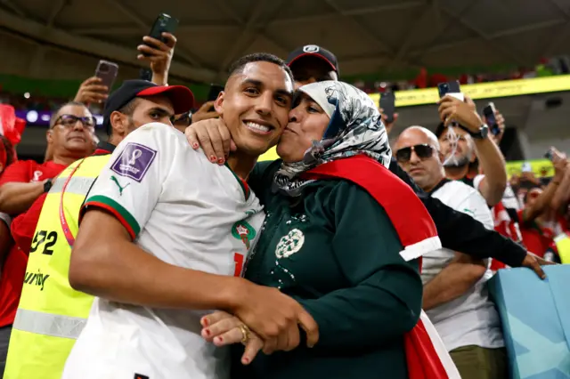 Morocco players celebrate with their friends and family