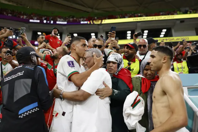 Morocco players celebrate with their friends and family