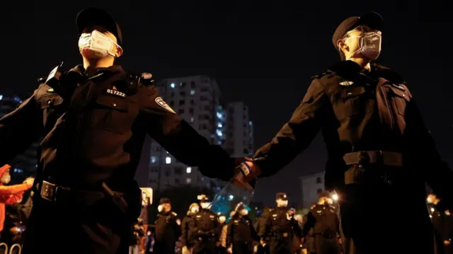 Police in Beijing during Sunday night's protests