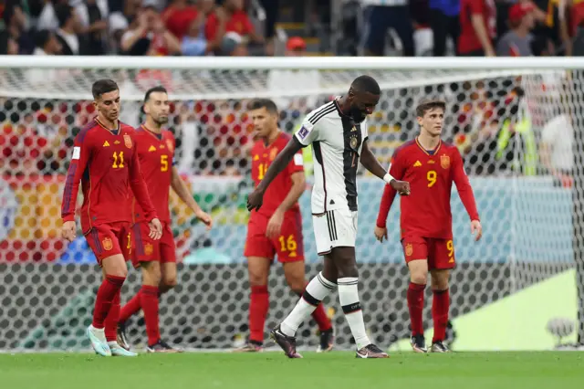 Antonio Rudiger reacts after sending a shot over the bar