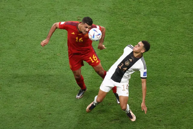 Rodri heads the ball