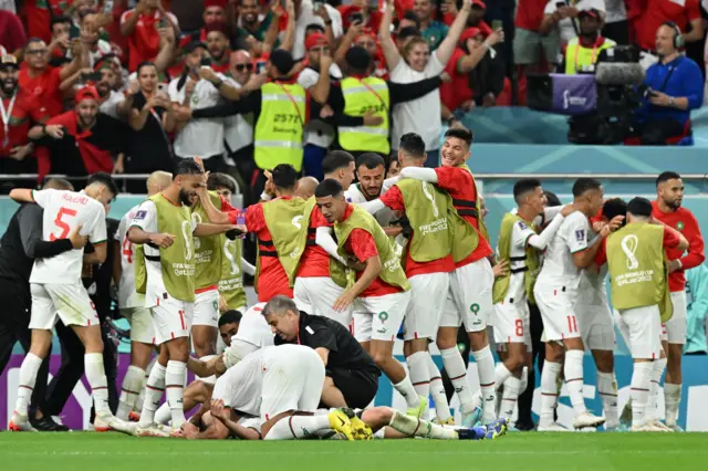 Morocco celebrate beating Belgium at the World Cup