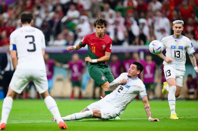 Joao Felix of Portugal (L) battles for possession with Jose Gimenez of Uruguay (R) during the FIFA World Cup Qatar 2022 Group H match between Portugal and Uruguay at Lusail Stadium on November 28, 2022 in Lusail City, Qatar