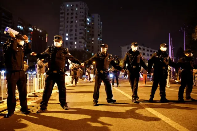 As the protests grew, police formed a cordon