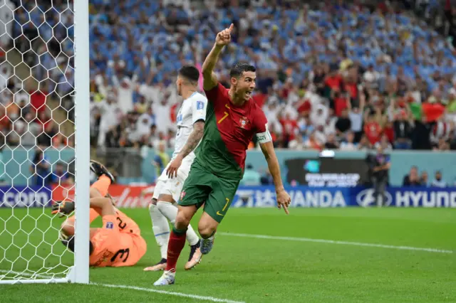 Cristiano Ronaldo of Portugal celebrates after scoring their team's first goal during the FIFA World Cup Qatar 2022 Group H match between Portugal and Uruguay at Lusail Stadium on November 28, 2022 in Lusail City, Qatar