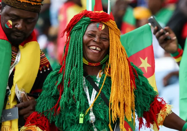 A smiling Cameroon fan