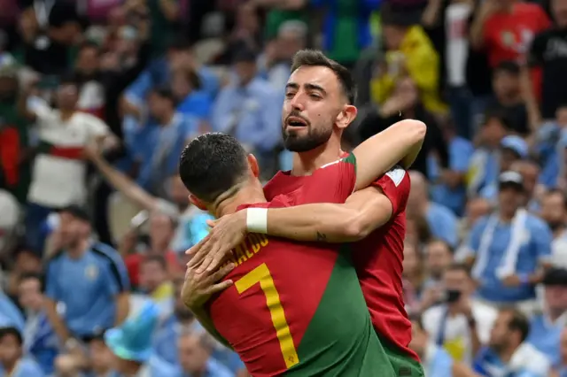 Cristiano Ronaldo of Portugal celebrates with Bruno Fernandes after scoring their team's first goal during the FIFA World Cup Qatar 2022 Group H match between Portugal and Uruguay at Lusail Stadium on November 28, 2022 in Lusail City, Qatar