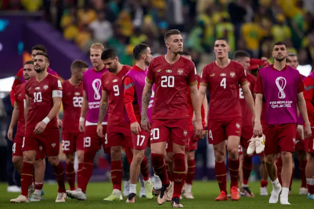 Serbia players look sad after defeat to Brazil