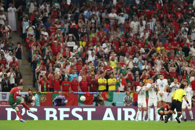 Portugal's Cristiano Ronaldo takes free-kick in World Cup match v Uruguay in Qatar