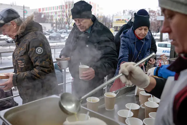 People receive hot drinks in Chernihiv