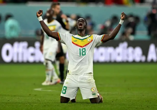 Senegal's Ismaila Sarr celebrates qualifying for the knockout stages of the World Cup