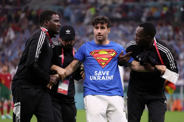 Pitch invader at Portugal v Uruguay