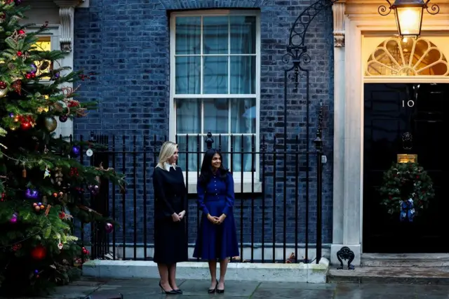 Ukraine's First Lady Olena Zelenska and Akshata Murty, British Prime Minister Rishi Sunak's wife, stand next to a Christmas tree outside Downing Street