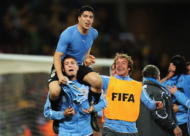 Luis Suarez celebrating with his team-mates after the game