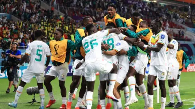 Senegal celebrate Sarr's goal