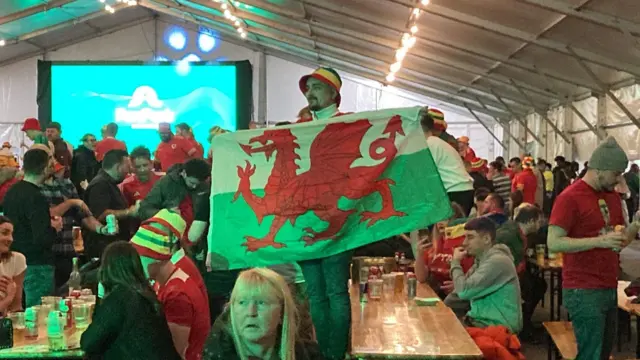 Football fans at a fanzone in Swansea