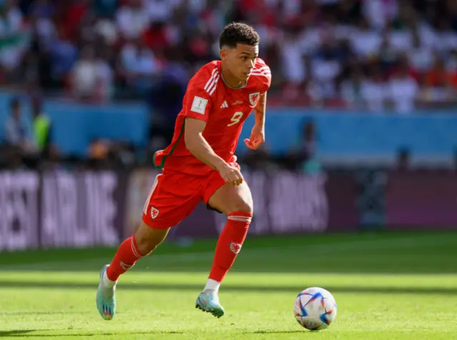 Brennan Johnson of Wales controls the ball during the FIFA World Cup Qatar 2022 Group B match between Wales and IR Iran at Ahmad Bin Ali Stadium on November 25, 2022 in Doha