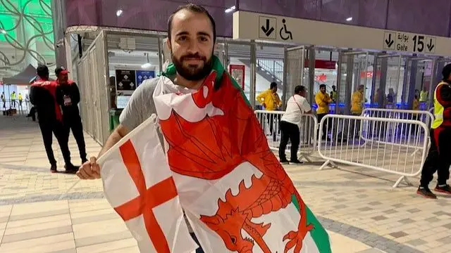 Harout Yacoubian, 24, from Lebanon, holding an English and Welsh flag