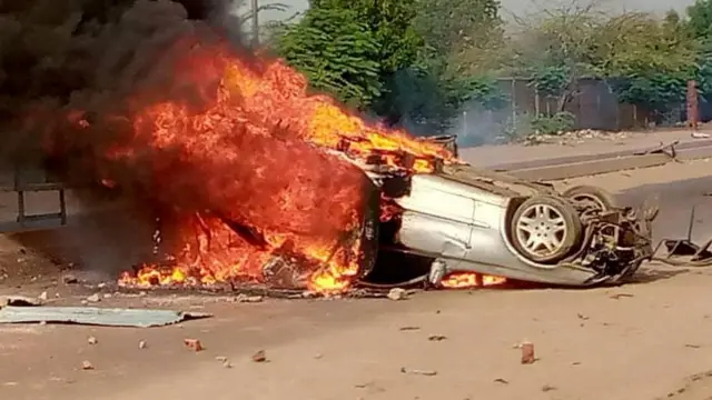 Smoke erupts from a vehicle set on fire during protests in N'Djamena, Chad, October 20, 2022